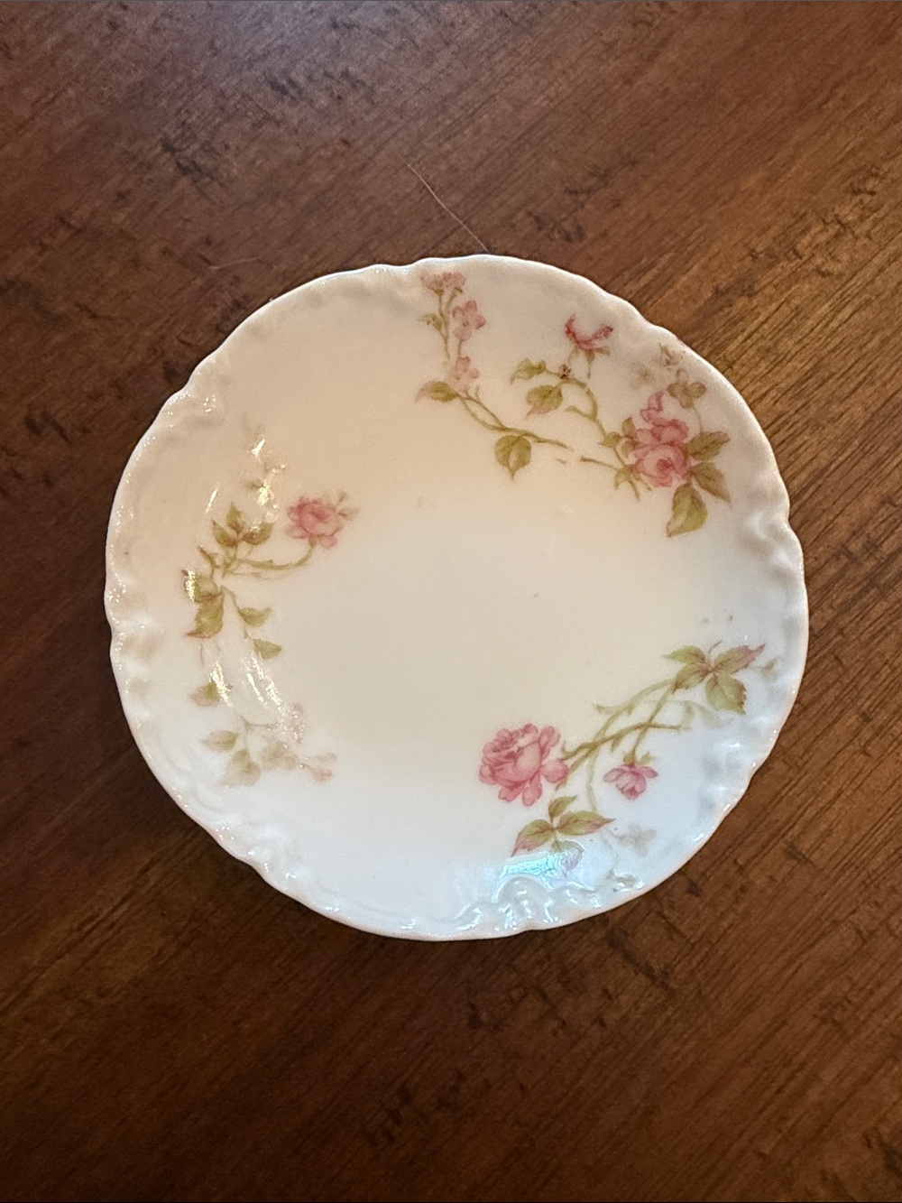 Haviland Limoges butter pat 3” with a beautiful scalloped edge